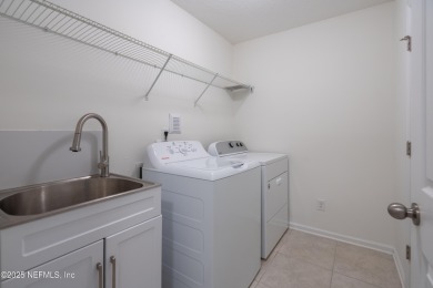 This charming Segovia townhome offers an inviting open floor on Slammer and Squire Golf Course in Florida - for sale on GolfHomes.com, golf home, golf lot