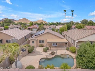 This beautifully maintained home features a sparkling salt water on The Golf Club At Johnson Ranch in Arizona - for sale on GolfHomes.com, golf home, golf lot