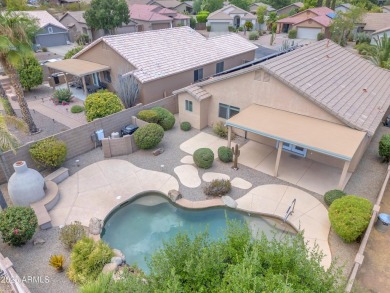 This beautifully maintained home features a sparkling salt water on The Golf Club At Johnson Ranch in Arizona - for sale on GolfHomes.com, golf home, golf lot