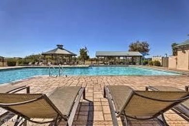 This beautifully maintained home features a sparkling salt water on The Golf Club At Johnson Ranch in Arizona - for sale on GolfHomes.com, golf home, golf lot