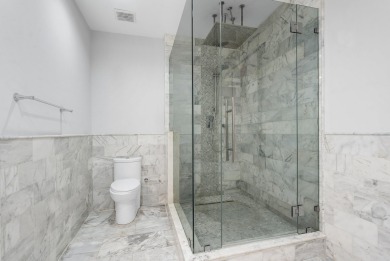 Experience modern elegance in this 4-bedroom, 3-bath condo with on Broken Sound Golf and Club  in Florida - for sale on GolfHomes.com, golf home, golf lot