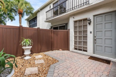 Experience modern elegance in this 4-bedroom, 3-bath condo with on Broken Sound Golf and Club  in Florida - for sale on GolfHomes.com, golf home, golf lot