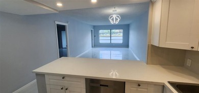 Spacious Remodel  Balcony/Sunroom enclosed for additional living on Palm-Aire Country Club and Resort - The Oaks in Florida - for sale on GolfHomes.com, golf home, golf lot