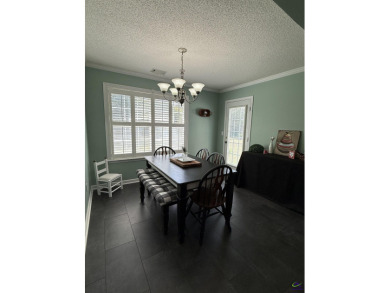Welcome to this spacious 4-bedroom, 2-bath home in the highly on The International City Golf Course in Georgia - for sale on GolfHomes.com, golf home, golf lot
