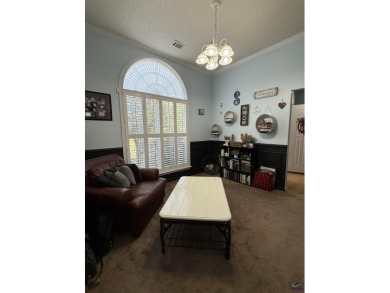 Welcome to this spacious 4-bedroom, 2-bath home in the highly on The International City Golf Course in Georgia - for sale on GolfHomes.com, golf home, golf lot