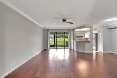 Perfectly located first floor condo residence with long views of on Bocaire Country Club in Florida - for sale on GolfHomes.com, golf home, golf lot