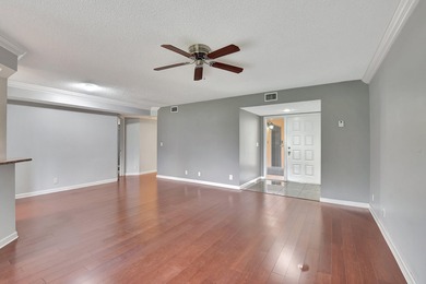 Perfectly located first floor condo residence with long views of on Bocaire Country Club in Florida - for sale on GolfHomes.com, golf home, golf lot