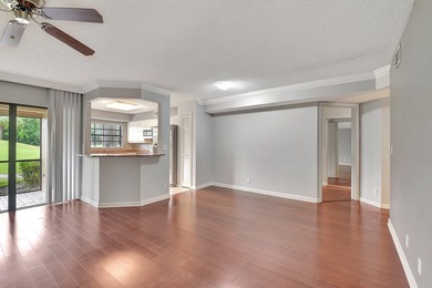 Perfectly located first floor condo residence with long views of on Bocaire Country Club in Florida - for sale on GolfHomes.com, golf home, golf lot