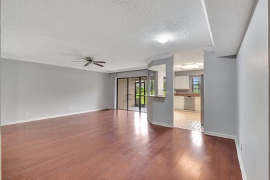 Perfectly located first floor condo residence with long views of on Bocaire Country Club in Florida - for sale on GolfHomes.com, golf home, golf lot