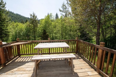 Located on a quiet half-acre lot with 100 feet of Lamb Creek on Priest Lake Golf and Tennis Club in Idaho - for sale on GolfHomes.com, golf home, golf lot