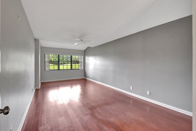 Perfectly located first floor condo residence with long views of on Bocaire Country Club in Florida - for sale on GolfHomes.com, golf home, golf lot