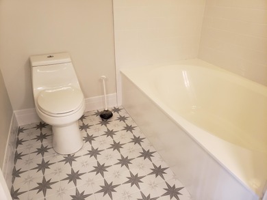 Perfectly located first floor condo residence with long views of on Bocaire Country Club in Florida - for sale on GolfHomes.com, golf home, golf lot