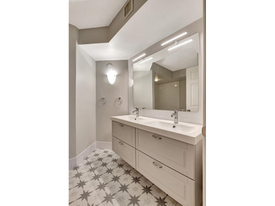 Perfectly located first floor condo residence with long views of on Bocaire Country Club in Florida - for sale on GolfHomes.com, golf home, golf lot