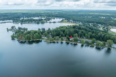 Incredible Main Canadian Lakes waterfront home.  One of the on Canadian Lakes Country Club-The Pines Course in Michigan - for sale on GolfHomes.com, golf home, golf lot