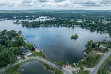 Incredible Main Canadian Lakes waterfront home.  One of the on Canadian Lakes Country Club-The Pines Course in Michigan - for sale on GolfHomes.com, golf home, golf lot