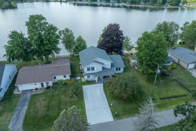 Incredible Main Canadian Lakes waterfront home.  One of the on Canadian Lakes Country Club-The Pines Course in Michigan - for sale on GolfHomes.com, golf home, golf lot