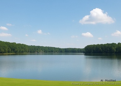 Exceptional .95-acre lakefront lot within the exclusive Pinewild on Pinewild Country Club of Pinehurst in North Carolina - for sale on GolfHomes.com, golf home, golf lot