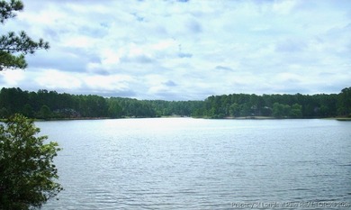 Exceptional .95-acre lakefront lot within the exclusive Pinewild on Pinewild Country Club of Pinehurst in North Carolina - for sale on GolfHomes.com, golf home, golf lot