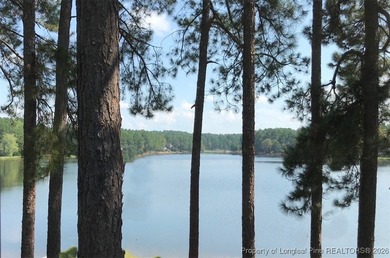 Exceptional .95-acre lakefront lot within the exclusive Pinewild on Pinewild Country Club of Pinehurst in North Carolina - for sale on GolfHomes.com, golf home, golf lot