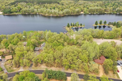 An attractive elevated waterfront lot overlooking the beautiful on Lake Arrowhead Golf Course - The Lakes in Wisconsin - for sale on GolfHomes.com, golf home, golf lot