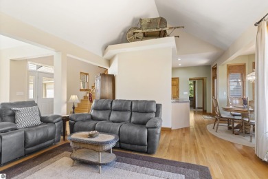 Perched on a quiet hilltop with sweeping views of Bear Lake and on  in Michigan - for sale on GolfHomes.com, golf home, golf lot