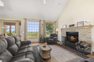 Perched on a quiet hilltop with sweeping views of Bear Lake and on  in Michigan - for sale on GolfHomes.com, golf home, golf lot