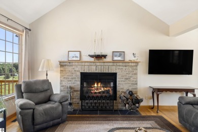Perched on a quiet hilltop with sweeping views of Bear Lake and on  in Michigan - for sale on GolfHomes.com, golf home, golf lot