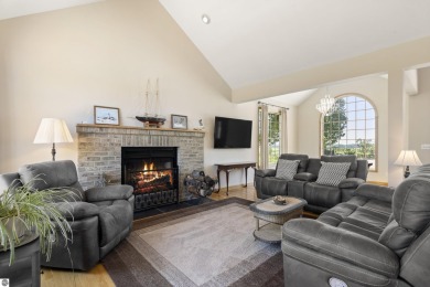 Perched on a quiet hilltop with sweeping views of Bear Lake and on  in Michigan - for sale on GolfHomes.com, golf home, golf lot