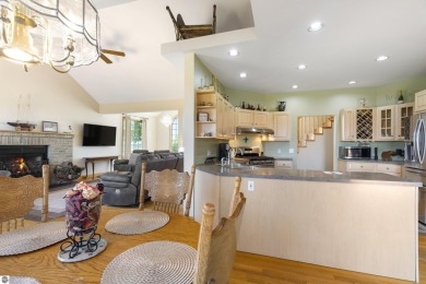 Perched on a quiet hilltop with sweeping views of Bear Lake and on  in Michigan - for sale on GolfHomes.com, golf home, golf lot