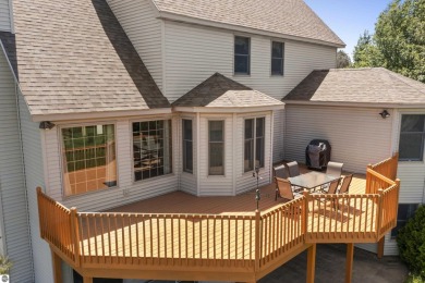 Perched on a quiet hilltop with sweeping views of Bear Lake and on  in Michigan - for sale on GolfHomes.com, golf home, golf lot
