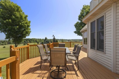 Perched on a quiet hilltop with sweeping views of Bear Lake and on  in Michigan - for sale on GolfHomes.com, golf home, golf lot