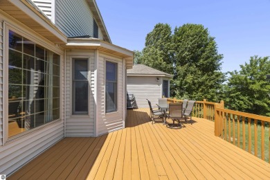Perched on a quiet hilltop with sweeping views of Bear Lake and on  in Michigan - for sale on GolfHomes.com, golf home, golf lot