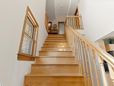 Perched on a quiet hilltop with sweeping views of Bear Lake and on  in Michigan - for sale on GolfHomes.com, golf home, golf lot