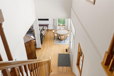 Perched on a quiet hilltop with sweeping views of Bear Lake and on  in Michigan - for sale on GolfHomes.com, golf home, golf lot