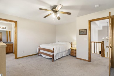 Perched on a quiet hilltop with sweeping views of Bear Lake and on  in Michigan - for sale on GolfHomes.com, golf home, golf lot