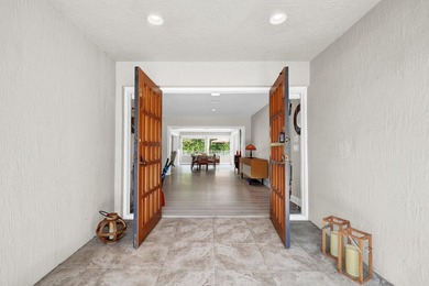 Situated on a nearly half-acre, fully fenced lot in a quiet on Pine Tree Golf Club in Florida - for sale on GolfHomes.com, golf home, golf lot