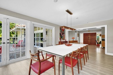 Situated on a nearly half-acre, fully fenced lot in a quiet on Pine Tree Golf Club in Florida - for sale on GolfHomes.com, golf home, golf lot