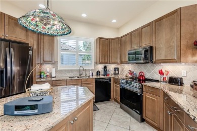 Enjoy golf & pond views from your paver lanai w/pool & spa in on The Club At Grandezza in Florida - for sale on GolfHomes.com, golf home, golf lot