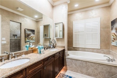 Enjoy golf & pond views from your paver lanai w/pool & spa in on The Club At Grandezza in Florida - for sale on GolfHomes.com, golf home, golf lot