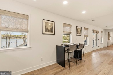 Welcome to this stunning lakefront home in the gated community on The Golf Club at Cuscowilla in Georgia - for sale on GolfHomes.com, golf home, golf lot