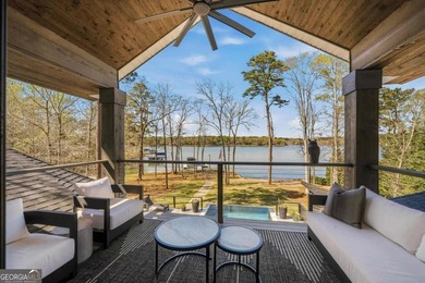 Welcome to this stunning lakefront home in the gated community on The Golf Club at Cuscowilla in Georgia - for sale on GolfHomes.com, golf home, golf lot