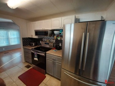 Come find your home sweet home in a beautiful manufactured home on Fairways Country Club in Florida - for sale on GolfHomes.com, golf home, golf lot