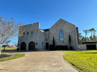 With a paved courtyard overlooking the first green of the Lake on Lake Charles Country Club in Louisiana - for sale on GolfHomes.com, golf home, golf lot