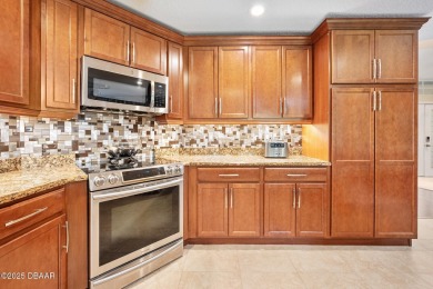 CAR COLLECTORS DREAM...This stunning, well-maintained, 3 bedroom on Halifax Plantation Golf Club in Florida - for sale on GolfHomes.com, golf home, golf lot