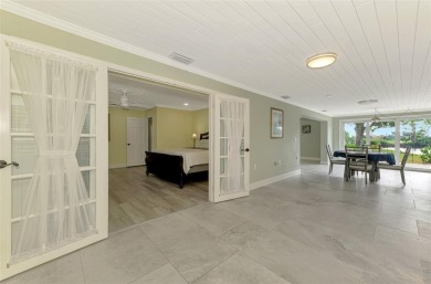 This stunning 3-bedroom, 2-bathroom lakefront home in the highly on Boca Royale Golf and Country Club in Florida - for sale on GolfHomes.com, golf home, golf lot