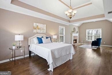 Welcome to this exceptional brick estate in the highly desirable on Towne Lake Hills Golf Club in Georgia - for sale on GolfHomes.com, golf home, golf lot