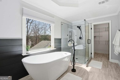 Welcome to this exceptional brick estate in the highly desirable on Towne Lake Hills Golf Club in Georgia - for sale on GolfHomes.com, golf home, golf lot