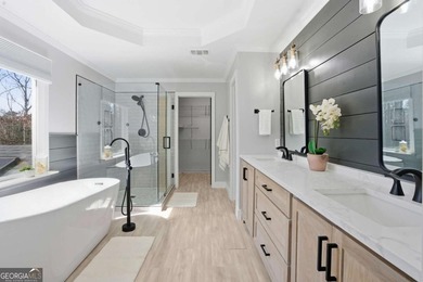 Welcome to this exceptional brick estate in the highly desirable on Towne Lake Hills Golf Club in Georgia - for sale on GolfHomes.com, golf home, golf lot