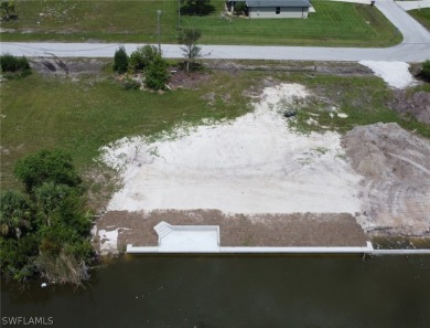 **Newly Completed SEAWALL with CONCRETE DOCK!**

Here's a great on Coral Oaks Golf Course in Florida - for sale on GolfHomes.com, golf home, golf lot