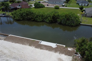 **Newly Completed SEAWALL with CONCRETE DOCK!**

Here's a great on Coral Oaks Golf Course in Florida - for sale on GolfHomes.com, golf home, golf lot